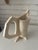 Wonky urn shape with impressed leaves from the garden. Very Bloomsbury-ish . Cream colored clay with transparent glaze.