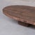A large oval coffee table. belgium, c1950s. created from old wood. Raised over two wooden stump blocks. wabi-sabi...