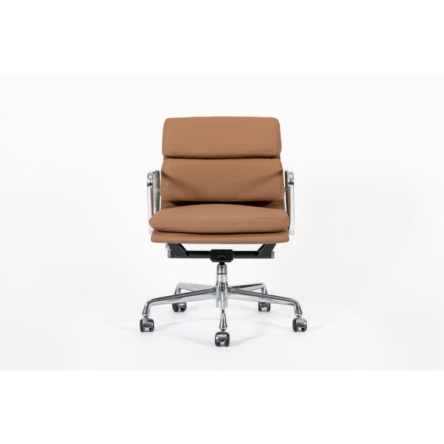 This authentic Eames for Herman Miller Soft Pad Management height brown office chair from the Aluminum Group Collection...