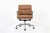 This authentic Eames for Herman Miller Soft Pad Management height brown office chair from the Aluminum Group Collection...