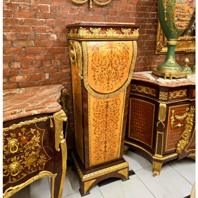 Showcase your finest sculptures, vases, or decorative accents with this magnificent French Empire-inspired pedestal stand....