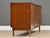 A mid century modern walnut three drawer two door credenza with light brass hardware made by Kent Coffey Tableau. Made in...