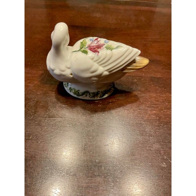 This little pomander duck is a vintage Elizabeth Arden painted porcelain figurine used as a fragrance diffuser. This is...