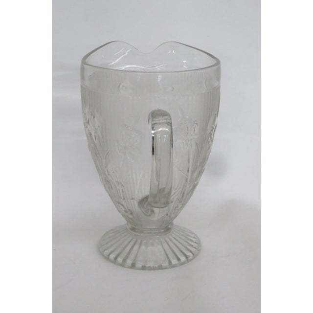 This gorgeous Footed Pitcher is made of clear pressed glass. This Pitcher has lovely vintage design; it features a...