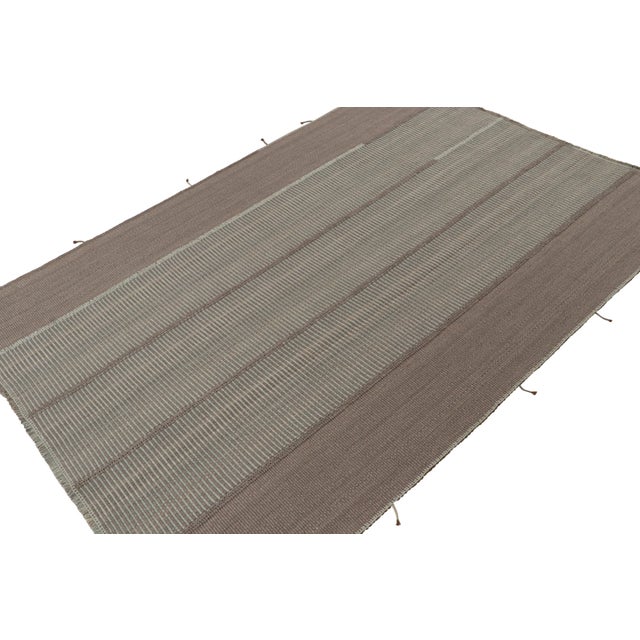 Handwoven in wool, this 9x12 Kilim is from a bold new line of contemporary flatweaves by Rug & Kilim. On the Design:...