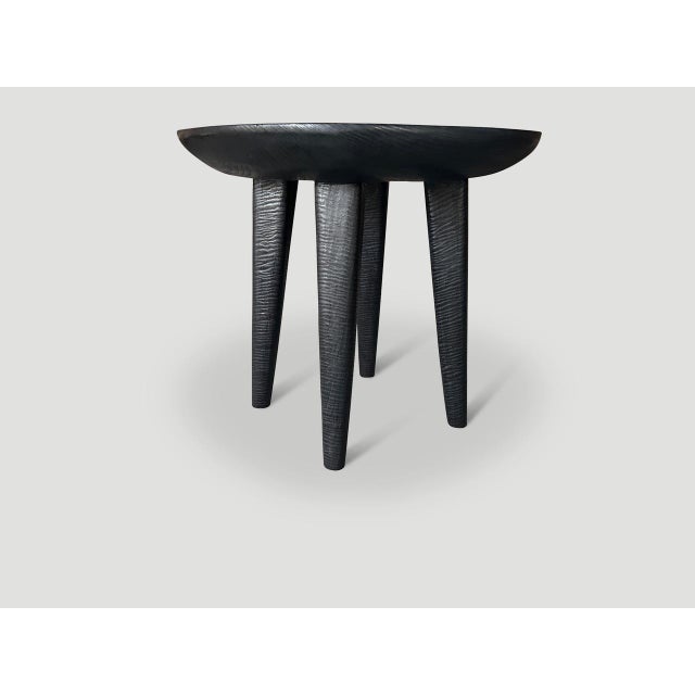 Minimalist side table with a three inch single slab bevelled top resting on cone style legs. Charred, sanded and sealed...