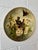 A beautifully hand-painted 19th century papier mâché charger, featuring a charming naturalist scene of birds tending a...