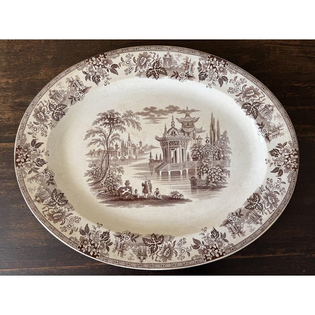 A Brownfield & Sons “Madras” pattern serving platter, marked to the verso.Rich brown tones run through the pattern. The...