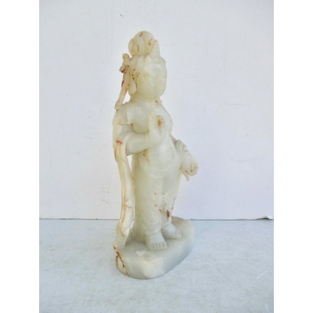 Soft and fine hand-carved carved standing Buddha. The classic figure stands with a hand gesture of blessing and giving....