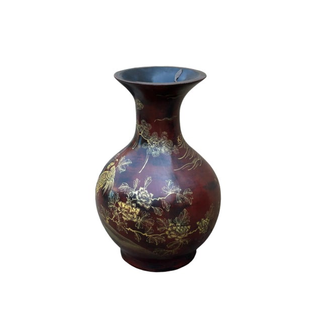 This magnificent vase is a stunning example of traditional craftsmanship, meticulously decorated with intricate details...