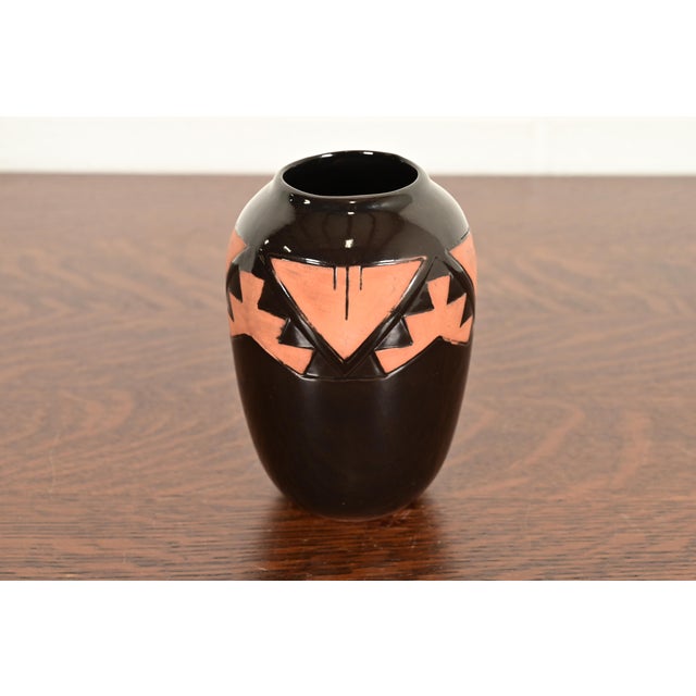 A gorgeous Navajo style glazed ceramic art pottery vase USA, Circa Late 20th Century Glazed ceramic, in a beautiful black...