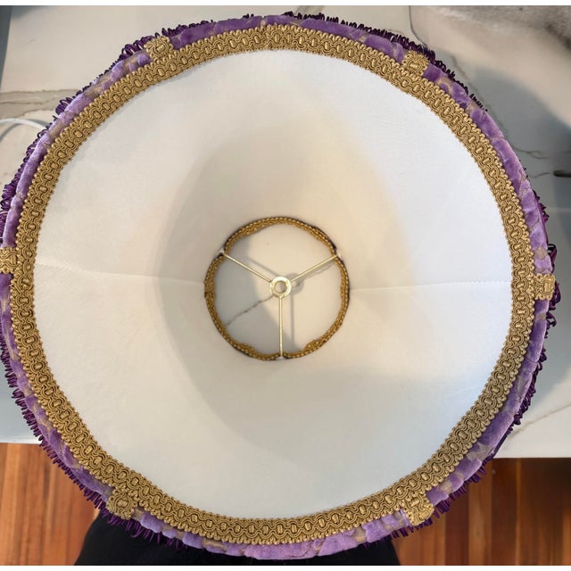 Bring timeless elegance to your home with this stunning vintage lamp shade featuring a luxurious purple velvet exterior...