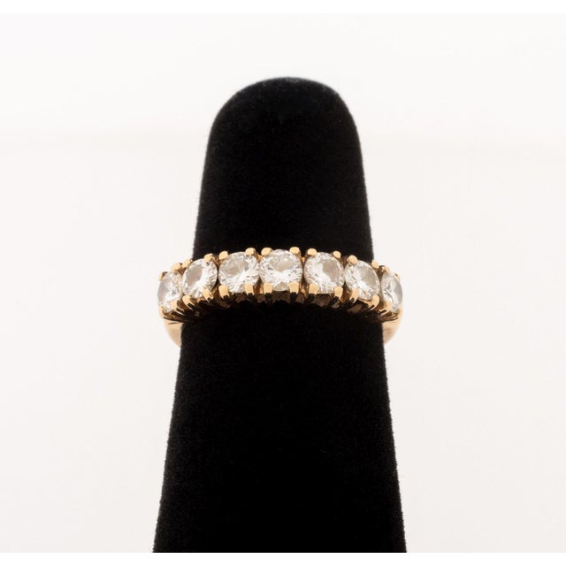 14K Yellow Gold Diamond Wedding Band, featuring seven prong set round brilliant cut diamonds weighing a total of approx....