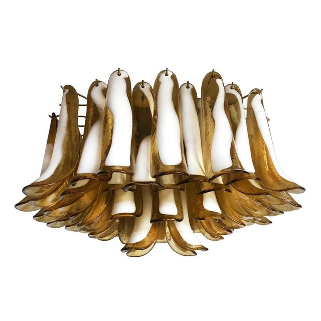 Pair of Spectacular ceiling lamps with 64 amber and lattimo Murano glass. Elegant lighting object. Period: late 20th...