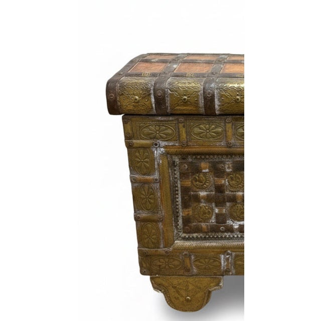 Made of wood and stamped brass, inlaid under bronze straps and rivulets, with a functional spade latch and wheels - nicely...