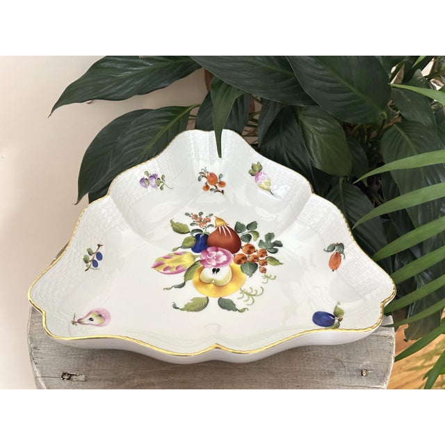 This striking triangular serving dish is not just functional dinnerware—it is a hand-painted work of art from the 1970s....