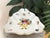 This striking triangular serving dish is not just functional dinnerware—it is a hand-painted work of art from the 1970s....