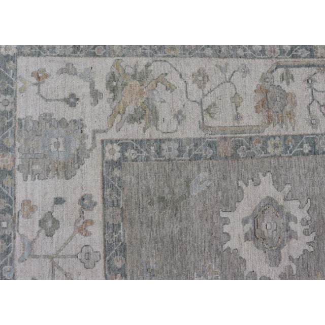 All-Over Floral Modern Oushak With Light Tan Background and Cream Border For Sale - Image 9 of 12