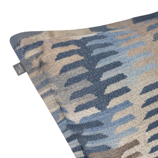 Infused with a playful palette of blues, this fabric features a modern, stepped pattern that brings an artistic energy to...