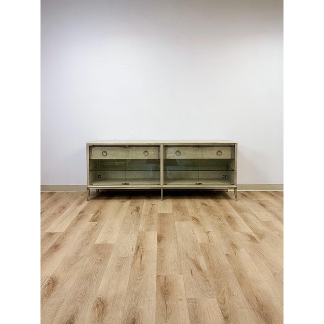 This painted gray entertainment console by American Drew's Corsica collection offers a fresh, updated take on the brand's...