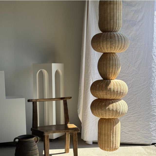 Huge column pendant light, a stack of spherical rattan volumes. Beautiful quality and craftsmanship of the rattan create...