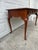 We have an absolutely beautiful vintage Queen Anne style console table for sale. Featuring a rich cherry toned wood...