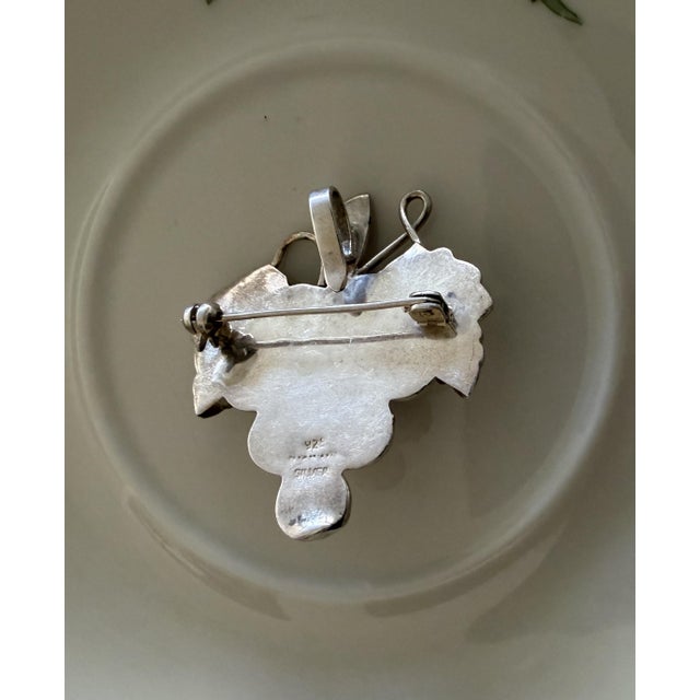 Taxco Mexican sterling silver brooch featuring a sculptural bunch of grapes with textured leaves