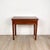 An early 19th-century English mahogany tea table with one drawer, circa 1800. Listed measurements are when closed; when...