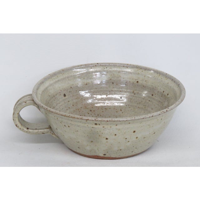 This gorgeous Bowl made out of ceramic, it has a lovely vintage mid century modern design, it has one handle, and it is...