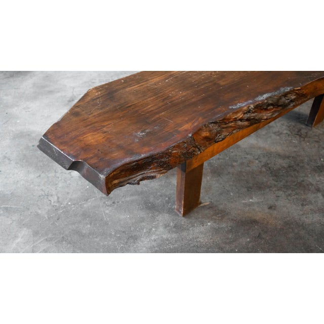 Vintage live edge bench or coffee table, rustic stylization, circa 1950s. Large wooden slab with exposed grain details and...