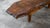 Vintage live edge bench or coffee table, rustic stylization, circa 1950s. Large wooden slab with exposed grain details and...