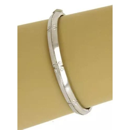 This authentic Tiffany & Co. bangle is finely crafted from solid 18k white gold with a polished and matte finish. It comes...