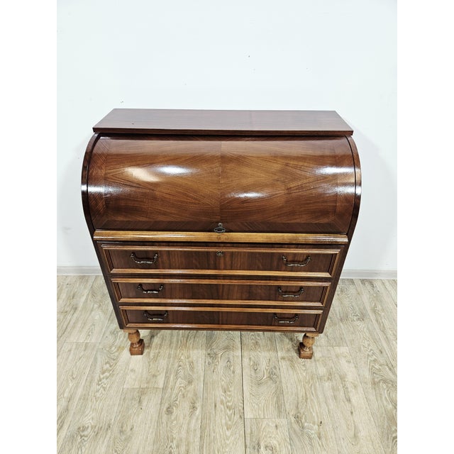 For sale: an exceptionally elegant, classic cylinder-top secretary desk (roll-top desk) in excellent visual and technical...
