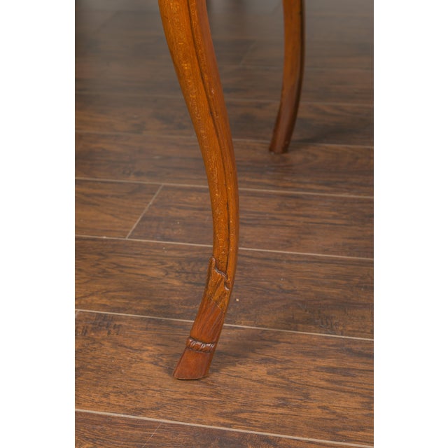 A French Napoleon III period walnut game table from the mid-19th century, with leather top and four drawers. Created in...