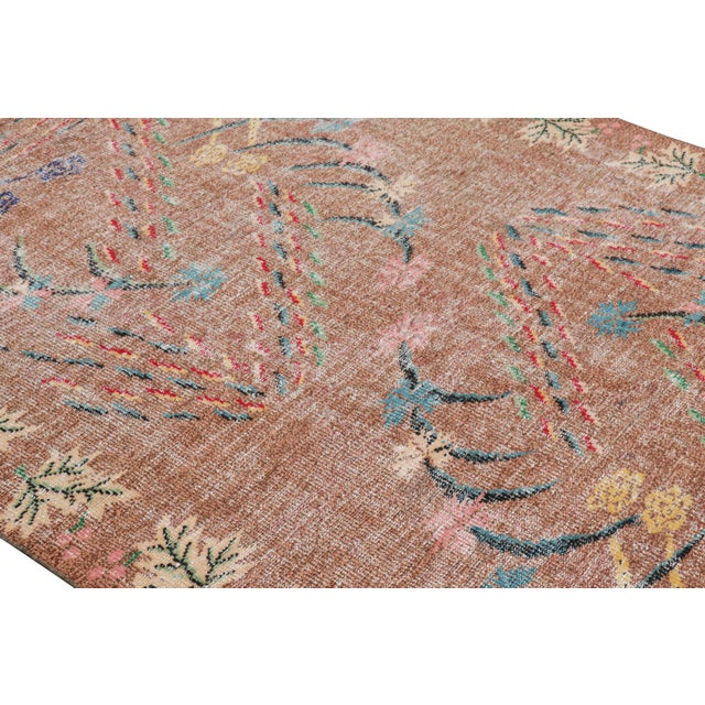 Hand-knotted in wool and originating from Turkey circa 1960 – 1970, this 6x9 vintage Zeki Müren rug is a unique addition...