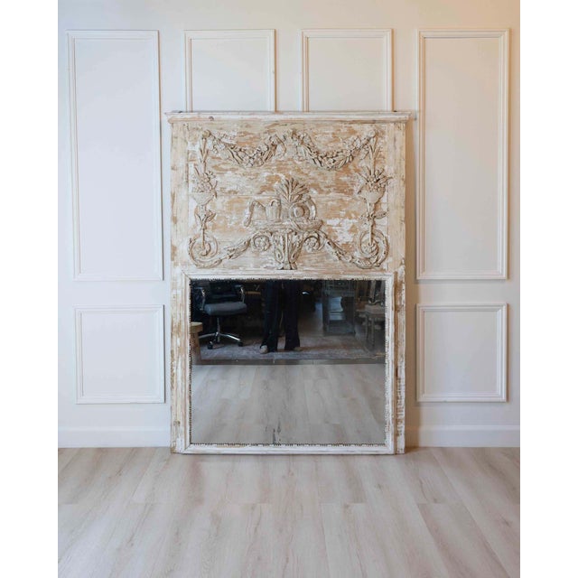 Made in France in the eighteenth century, this large paneled screen is made of carved wood in the Louis XVI style and...