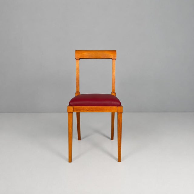 Italian mid-century modern wooden chairs with burgundy sky, 1940s Set of six chairs with solid wood frames and padded...