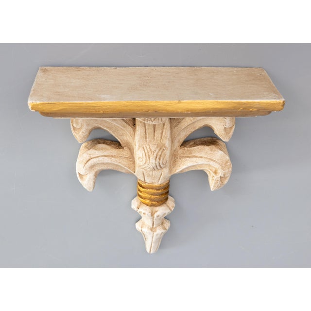 A gorgeous mid 20th-Century Italian Neoclassical-style gilt wood wall bracket or corbel. This lovely bracket has a...