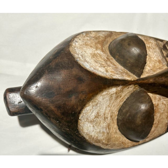 Hand carved wood and clay Mbagani mask from the Democratic Republic of the Congo, Southern Kasai Region. Showcases...