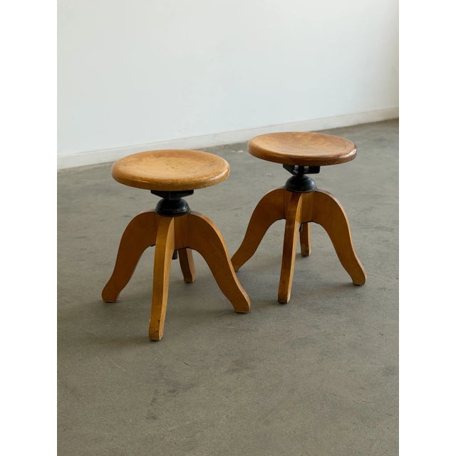 Base Width 19 Seat Width 14 Height 19.5 Charming vintage swivel stools featuring sculptural curved legs and warm original...