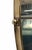 Wall-mounted mirror with a brass frame, dating from around the 1950s. This shape is rare in this style of mirror. It is in...