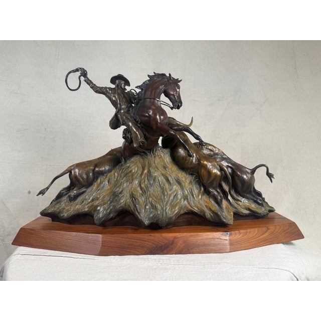 A commanding and museum-quality bronze sculpture titled Range Rights by celebrated contemporary Western sculptor Chris...