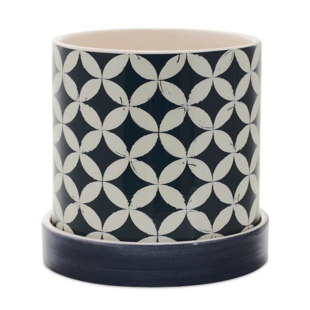 Elevate your home decor with the sleek and modern design of this Geometric Pattern Planter Set. Crafted from durable...