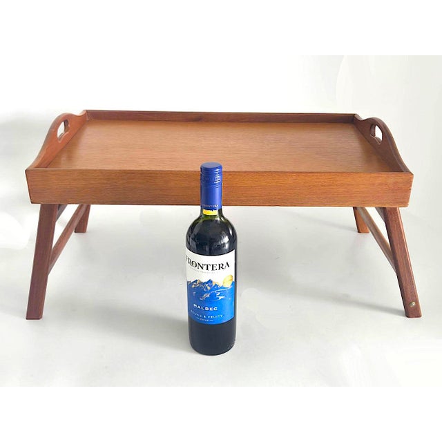 Offered is a mid 20th Century vintage Dolphin-brand Teak wood folding tray with handles made in Thailand in the 1970s....