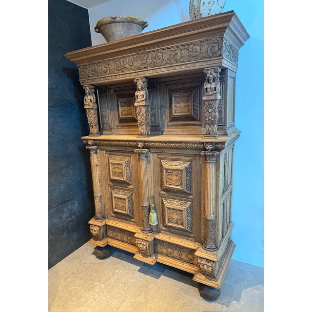 A superb example of a Flemish Carved Oak Cabinet dating to the late 18th Century. Fine carvings adorn the piece and sits...