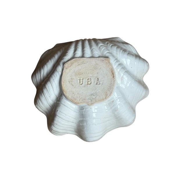 Large stoneware clamshell bowl showing aged character and authenticity. Rough unfinished interior inherent to design....