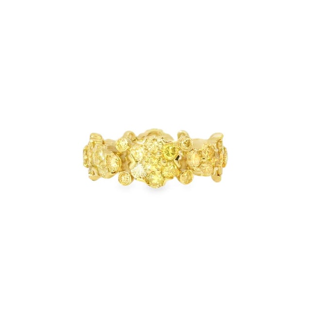 Beautiful 14K yellow gold eternity wedding band featuring numerous brilliant round yellow diamonds totaling 3.5 carats....