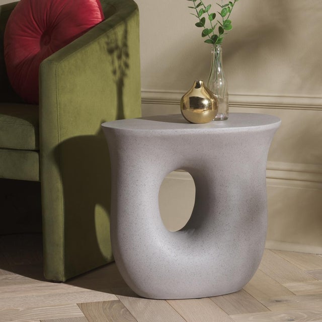 Add a sculptural flair to your home with our stunning Irelyn accent table. With an organic and striking silhouette, our...