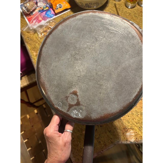 Heavy antique French copper pot with copper lid. Heavy cast iron handles on pot and lid. Handmade and stamped by maker.