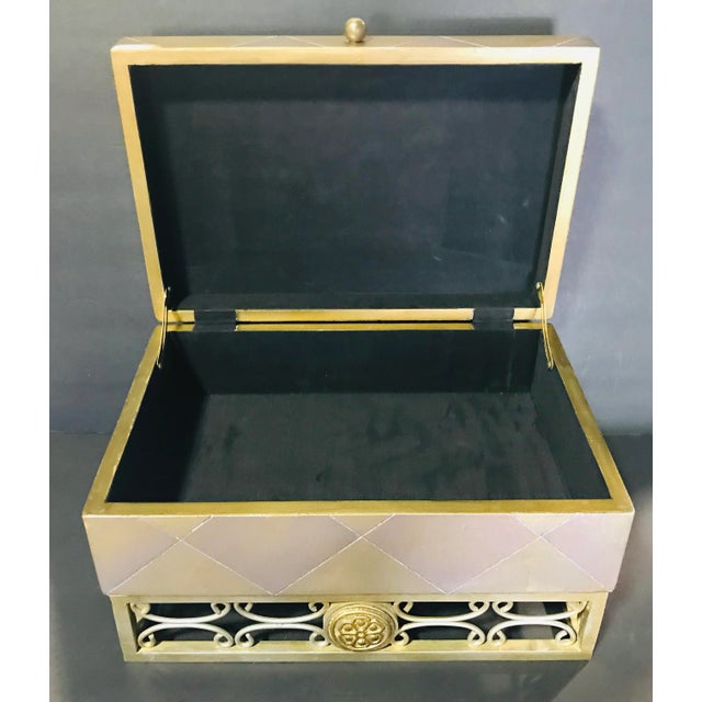 Stunning decorative box Made Of wood and metal Meas: 8” tall x 10” W x 15 L His stunning box will brighten any rod. Box is...